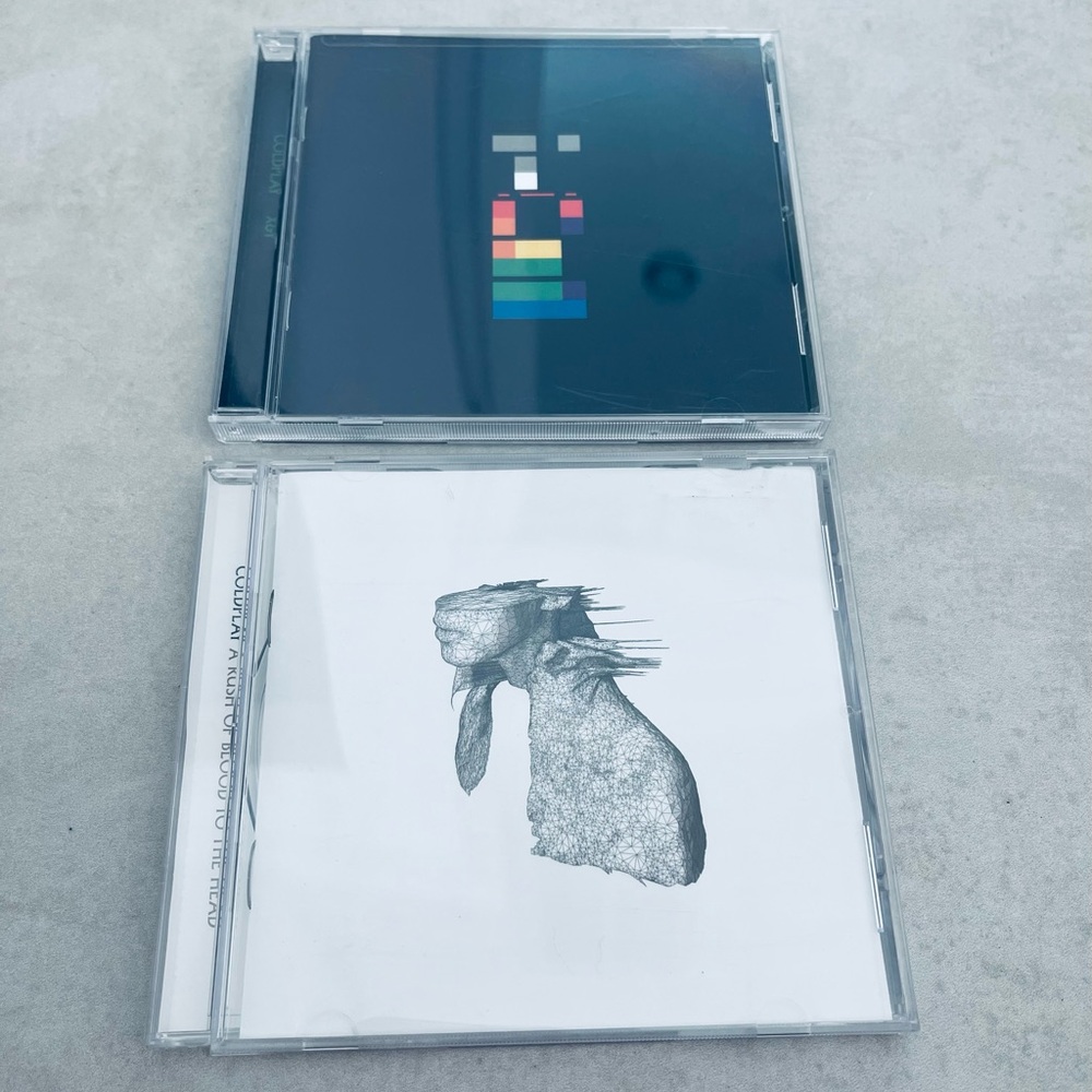 2 Audio Cold Play CDs.